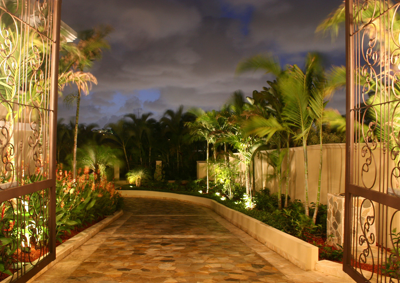 Outdoor lighting of a house's long driveway at night